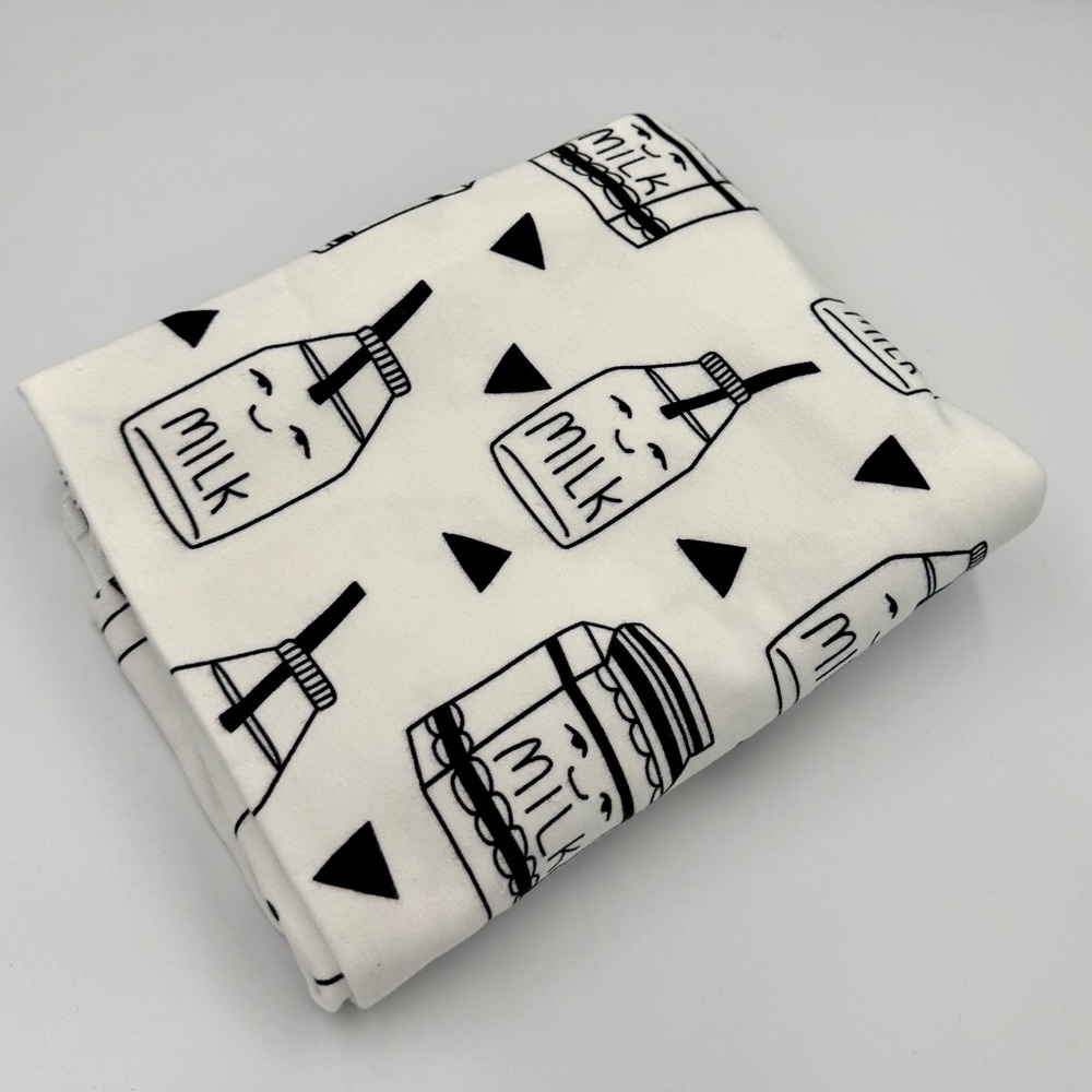 Euro Fabric. 1 yard Milk print on white French Terry